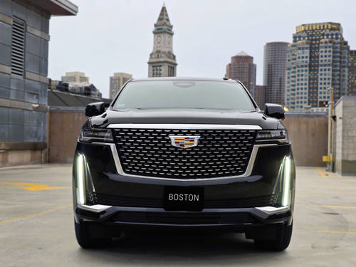 Front view of Cadillac Escalade on a Boston rooftop parking garage