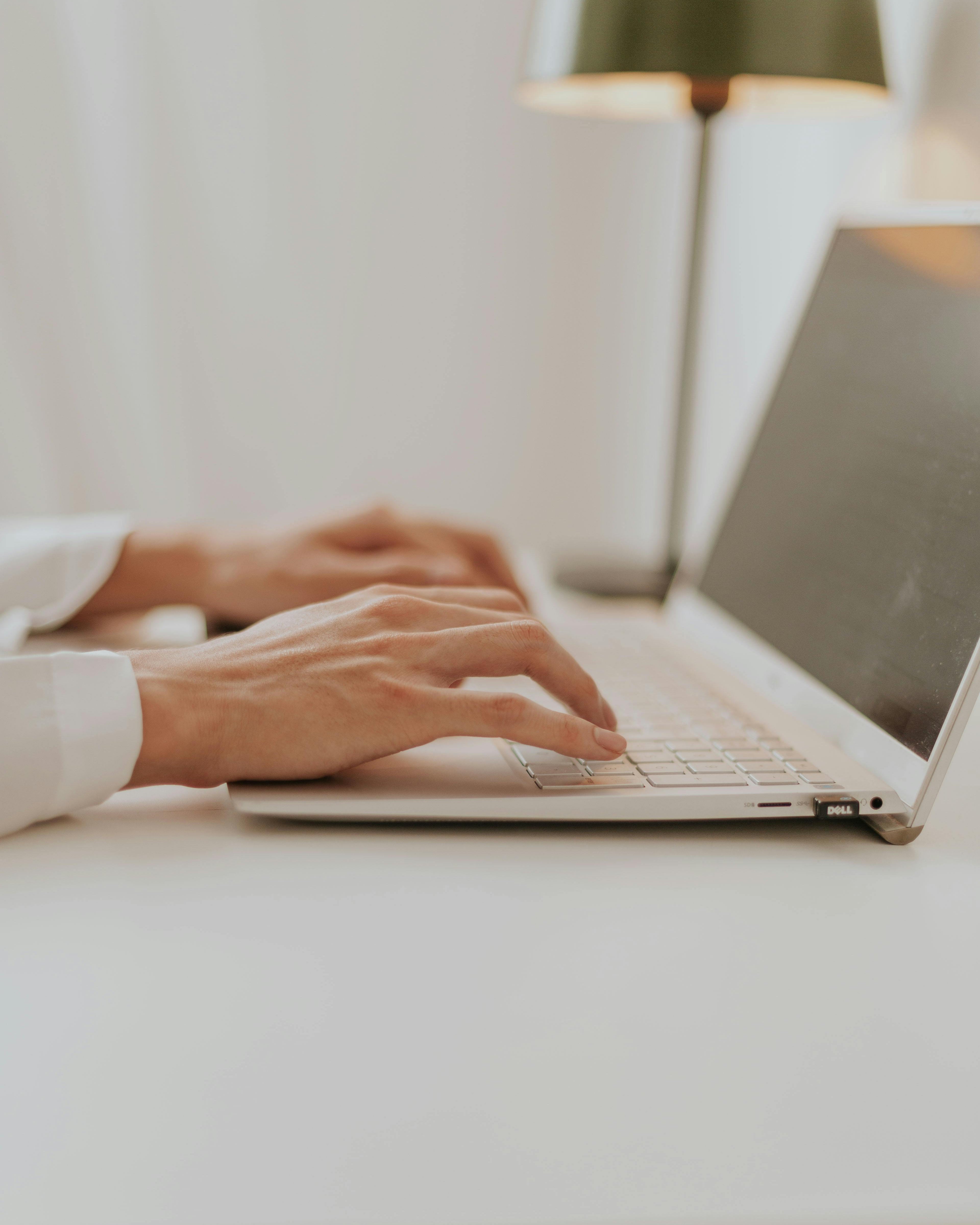 Customer support team member working on a laptop