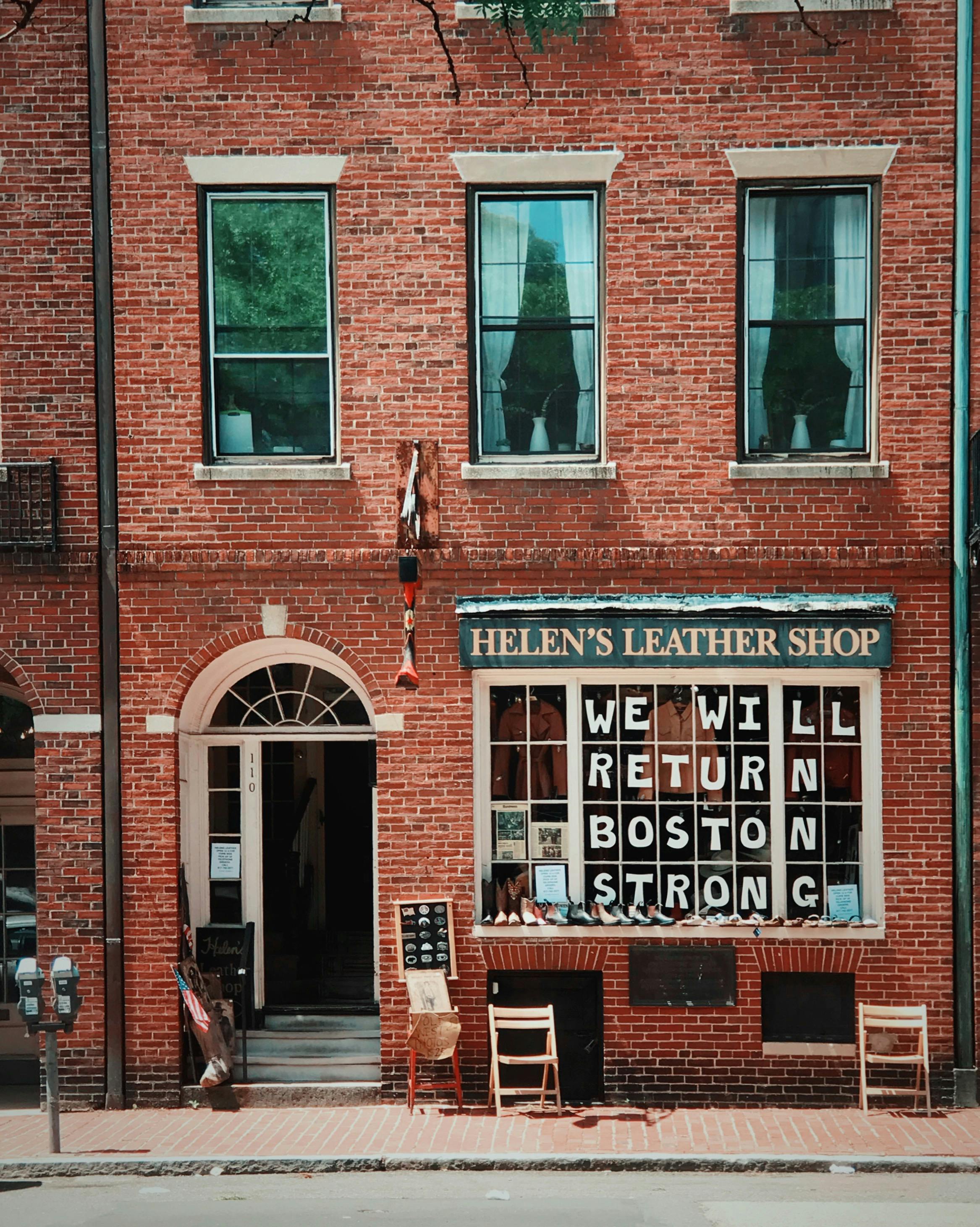 Helen’s Leather Shop storefront in Boston with “Boston Strong” message in the window