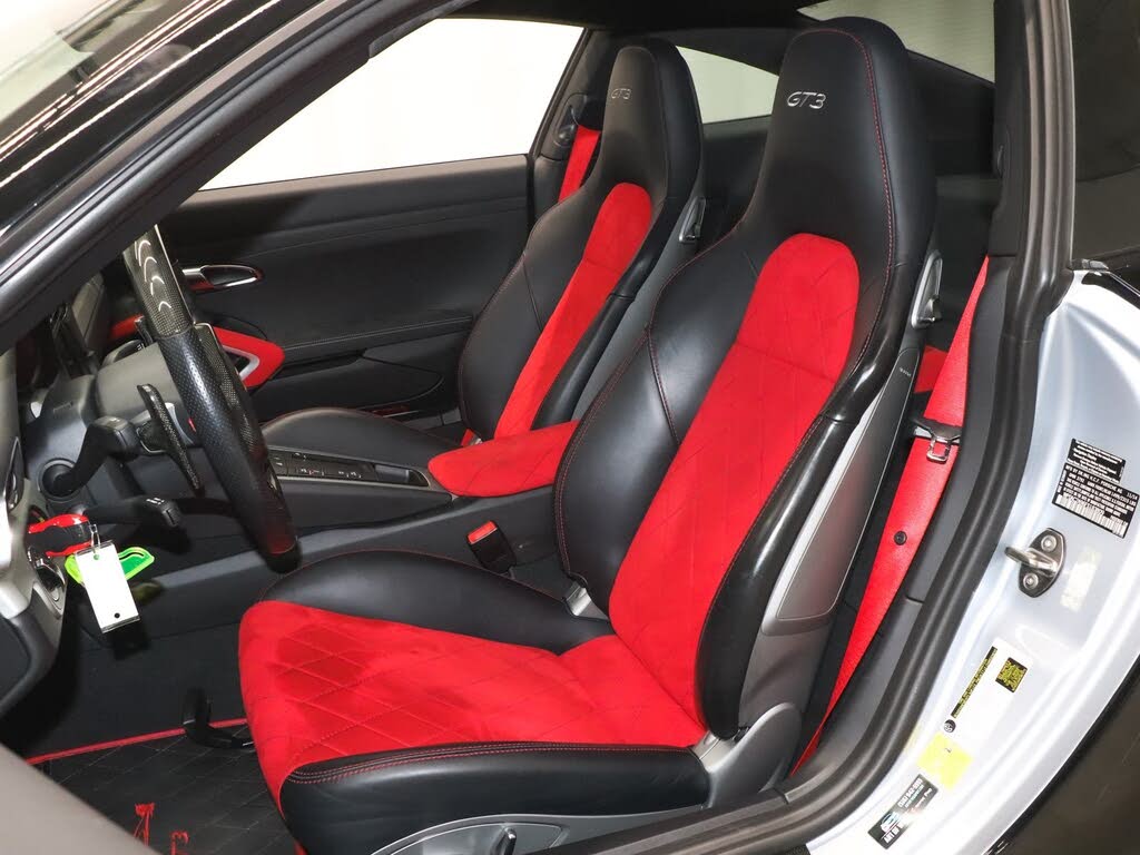 Porsche 911 GT3 interior showing red and black sport bucket seats