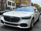 White Mercedes-Maybach luxury sedan in downtown Boston