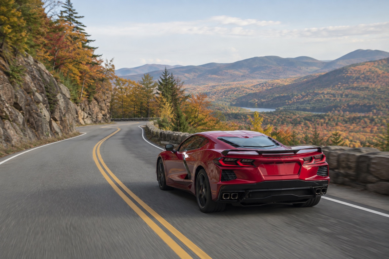 A Lamborghini Huracán on a scenic New England road near Boston in autumn