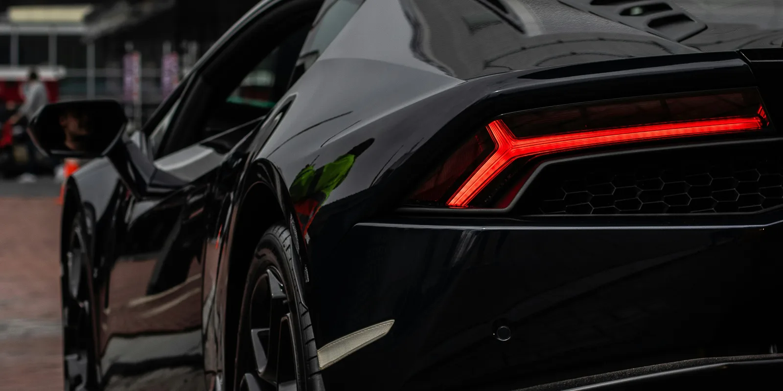 Lamborghini Huracán taillight close-up, representing the Huracán and Urus available to rent in Boston